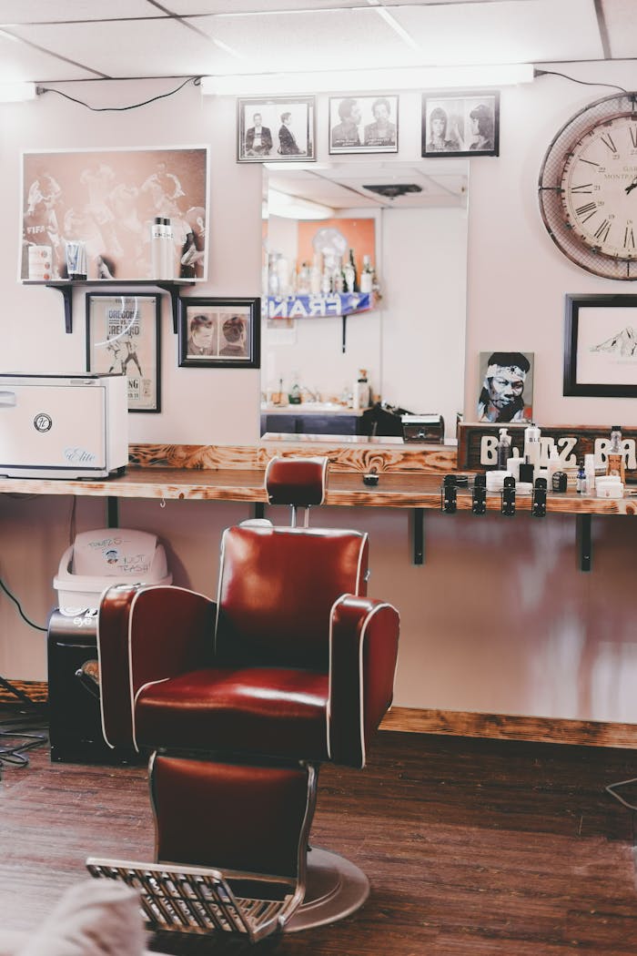 Interior design of modern light hairdressing studio with cozy leather chair and stylish decorative elements