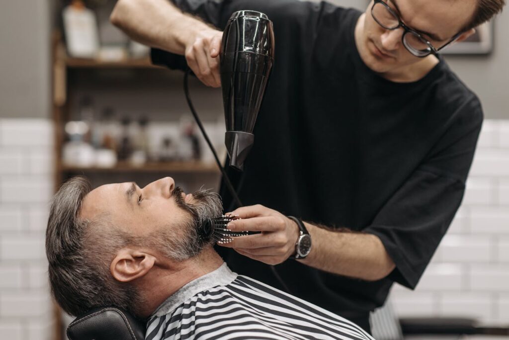 Close-Up Shot of a Man Getting His Beard Styled